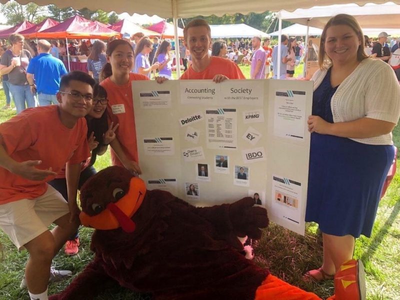 Joshua Del Rosario, Tess Jensen, Hannah Hipolito, Hokie Bird, Dominik Renteria, and Hope Hodges (left to right) representing the VT Accounting Society at the 2019 Pamplin Picnic. 