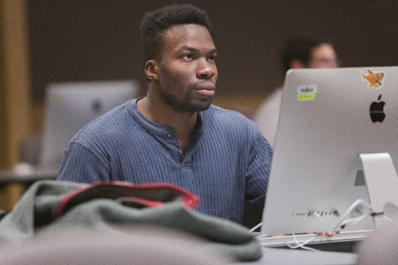 ACIS 3504 student in computer lab.