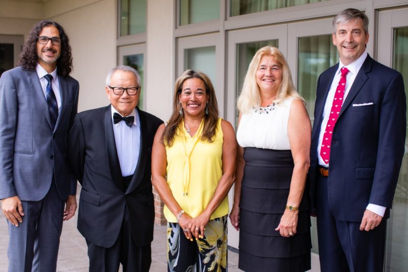 The five Academy of Engineering Excellence inductees smile at the camera together