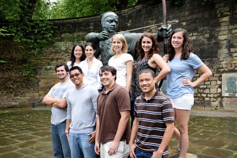 students posing at Robin Hood statue in Nottingham