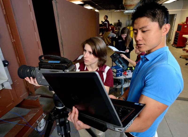 Graduate student looking at laptop