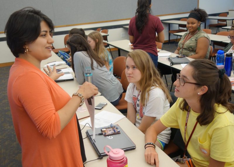 Faculty talking to students