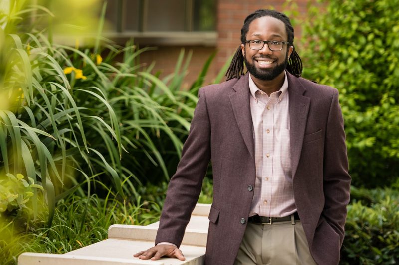 Dr. Walter Lee standing amongst plants