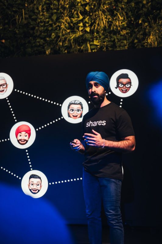 Harjas Singh speaks on stage