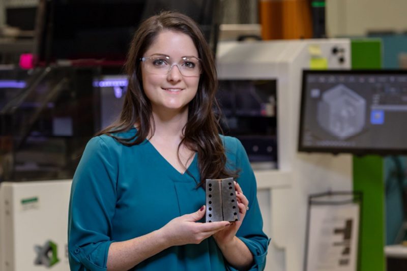 Amy Elliott holds 3D-printed object