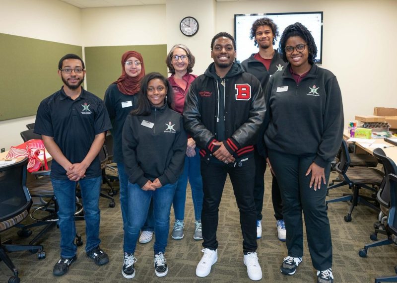 Kenneth Dorsey Jr. (third from right) smiles with Virginia Tech NSBE members