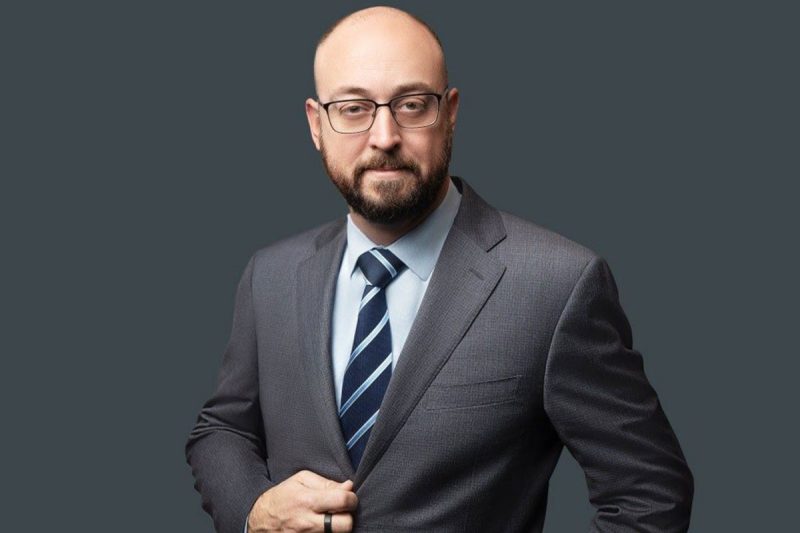 Professional headshot of Stephen Gillotte wearing a suit