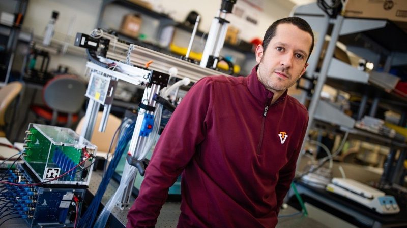 Eli Vlaisavljevich stands in his Therapeutic Ultrasound and Noninvasive Therapies Laboratory.