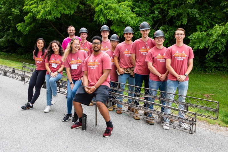 The Steel Bridge design team poses for a photo with their bridge