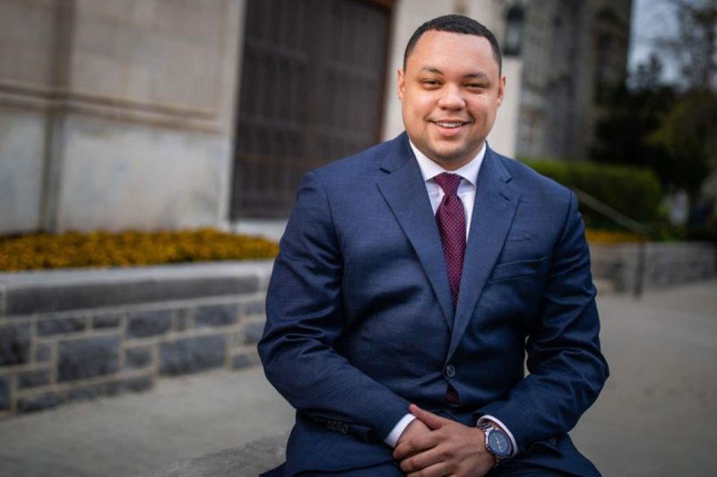 Terelle Cadd poses in front of a Hokie stone building