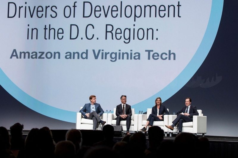 A panel of people on stage present the Amazon and Virginia Tech connection.