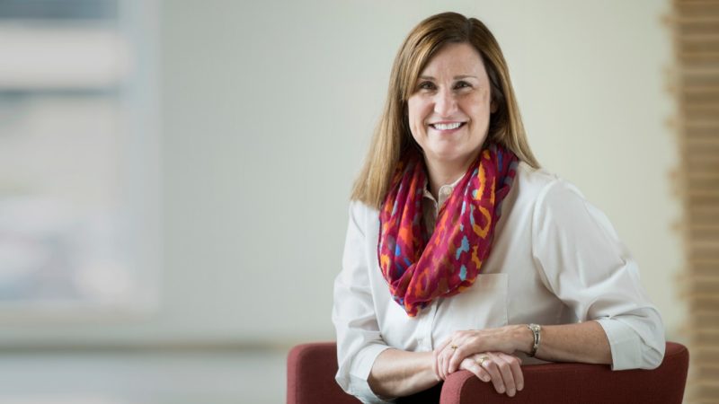 Julia Ross the new Dean of Engineering sits in a maroon chair posing for the camera