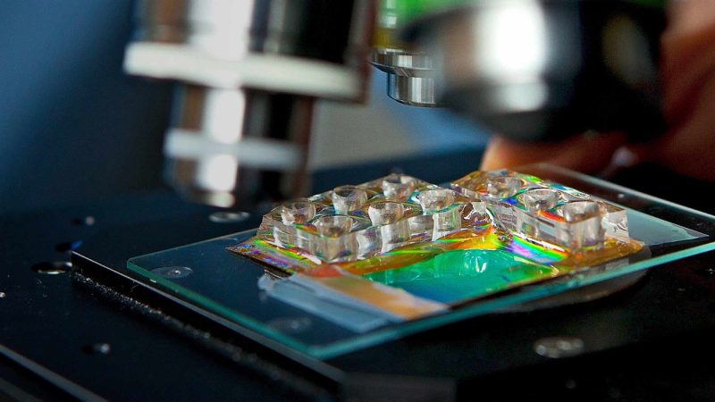 Close up of a experiment on a microscope stage.