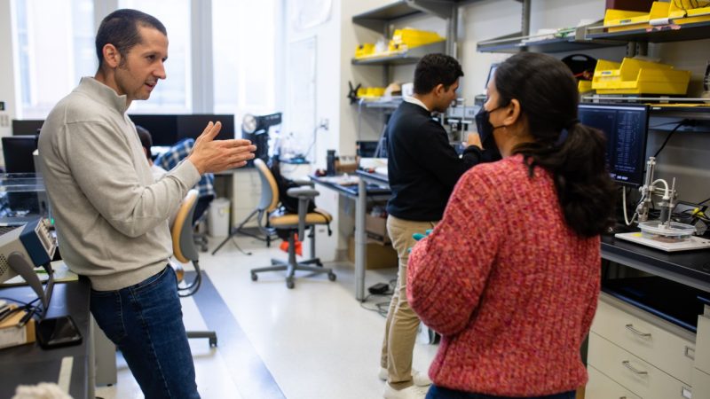 Eli Vlaisavljevich working with students in his lab.