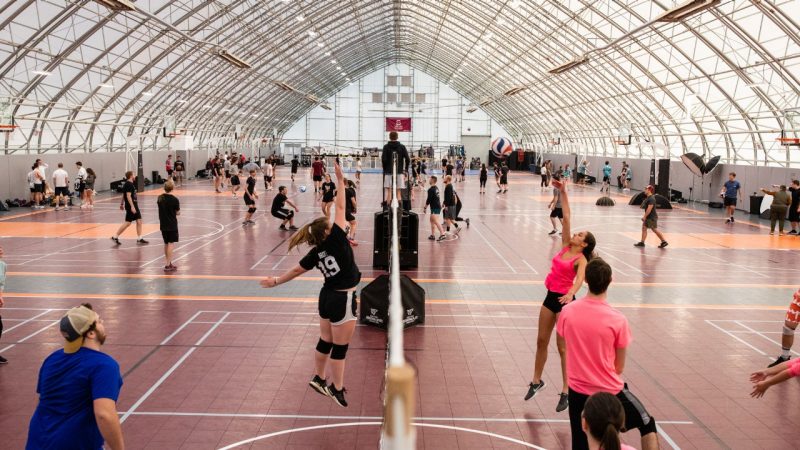 Students playing volleyball.