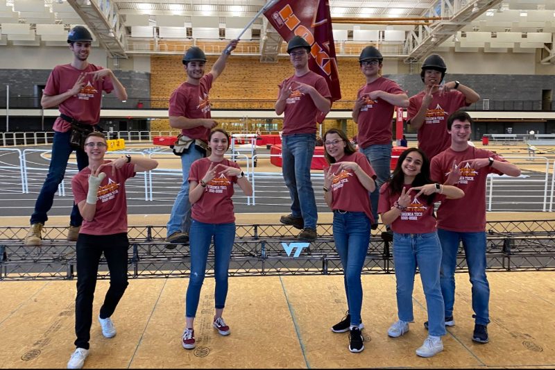 Group shot of the Steel Bridge Team doing the VT handsign.