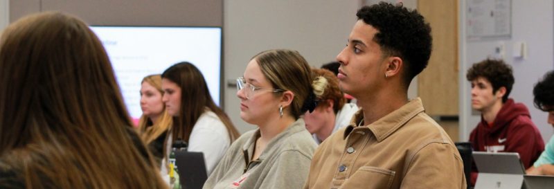 Students listening to professor lecture