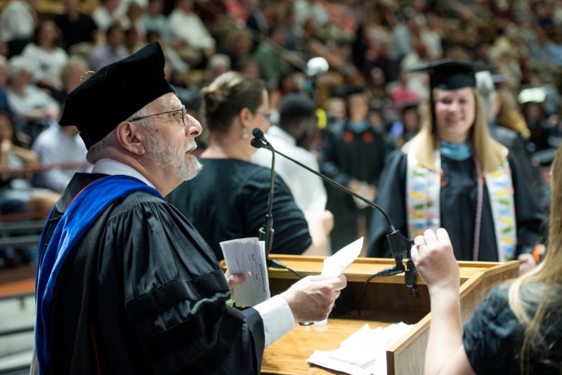 Joe Merola reads names at commencement