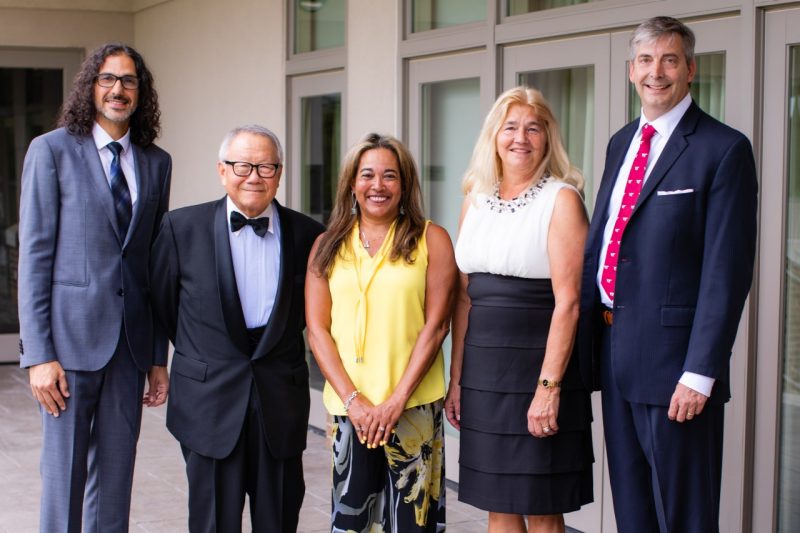 The five Academy of Engineering Excellence inductees smile at the camera together