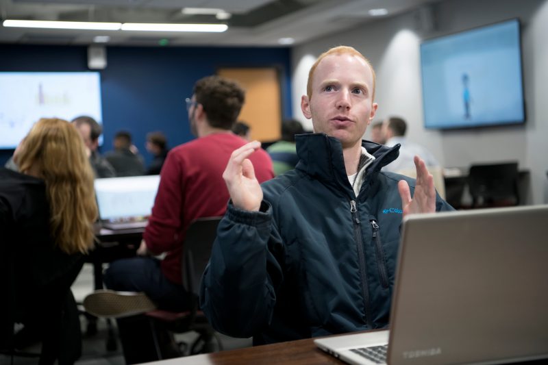 Image of student speaking to group