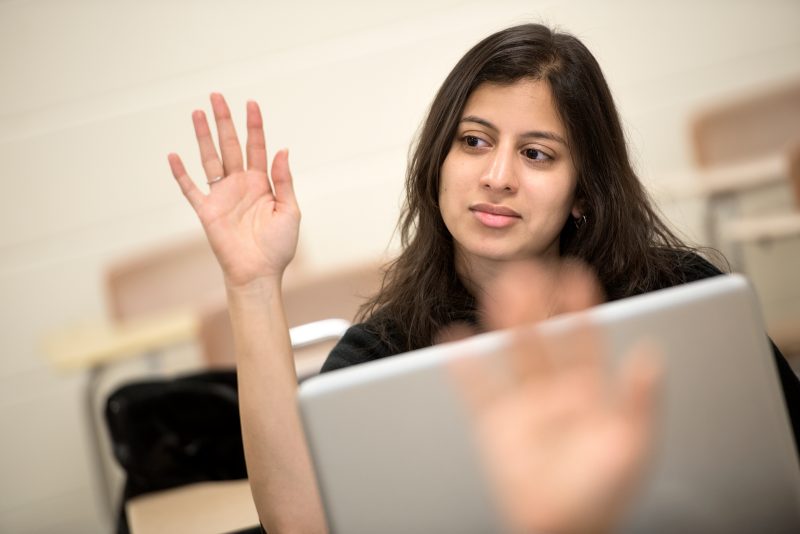 Woman raising hand