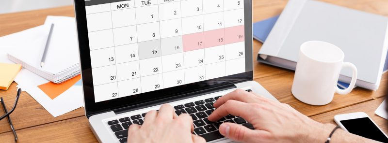 Student filling out calendar on computer