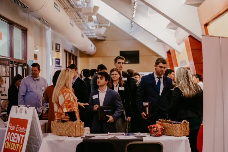 picture of students talking with companies