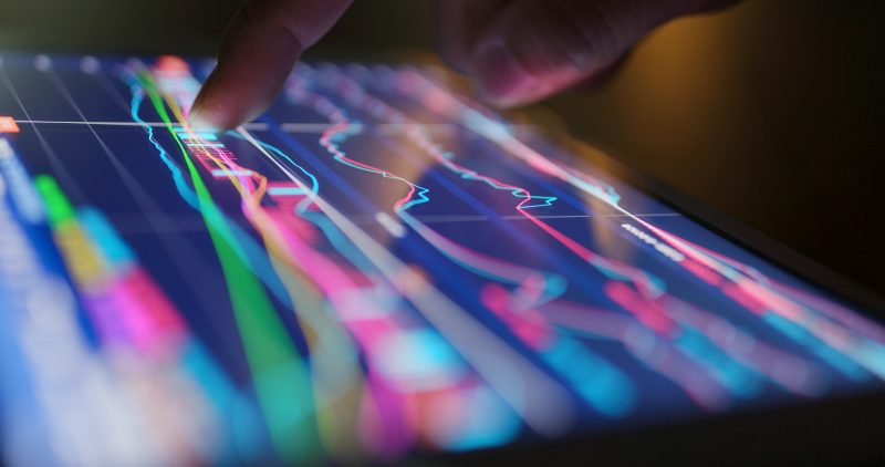 Person viewing data illustrations on screen